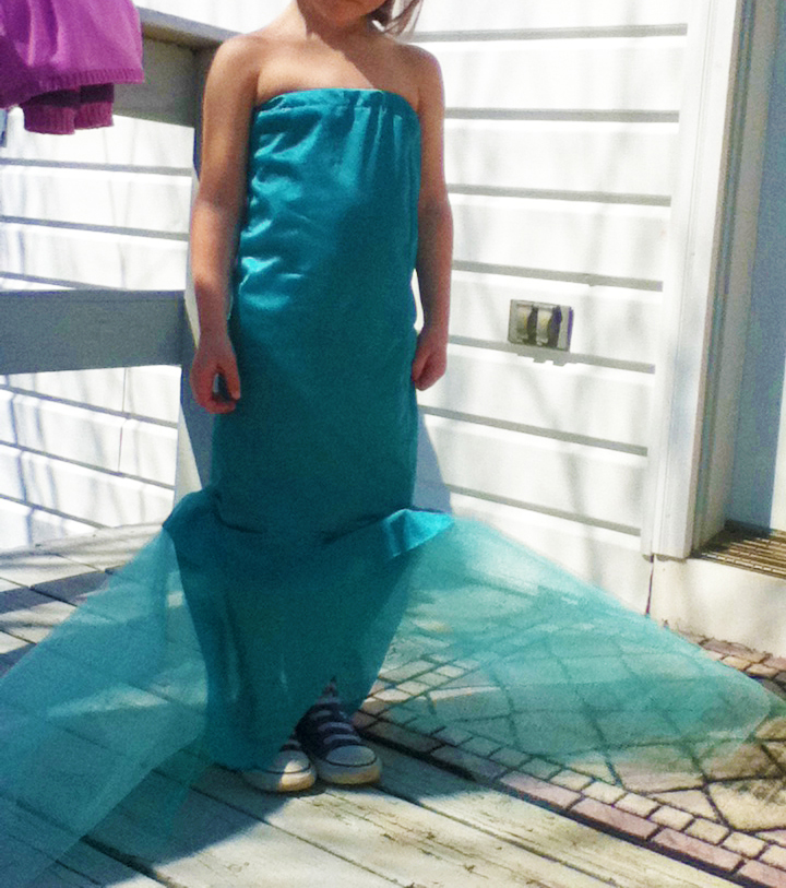 girl wearing mermaid dress/tail